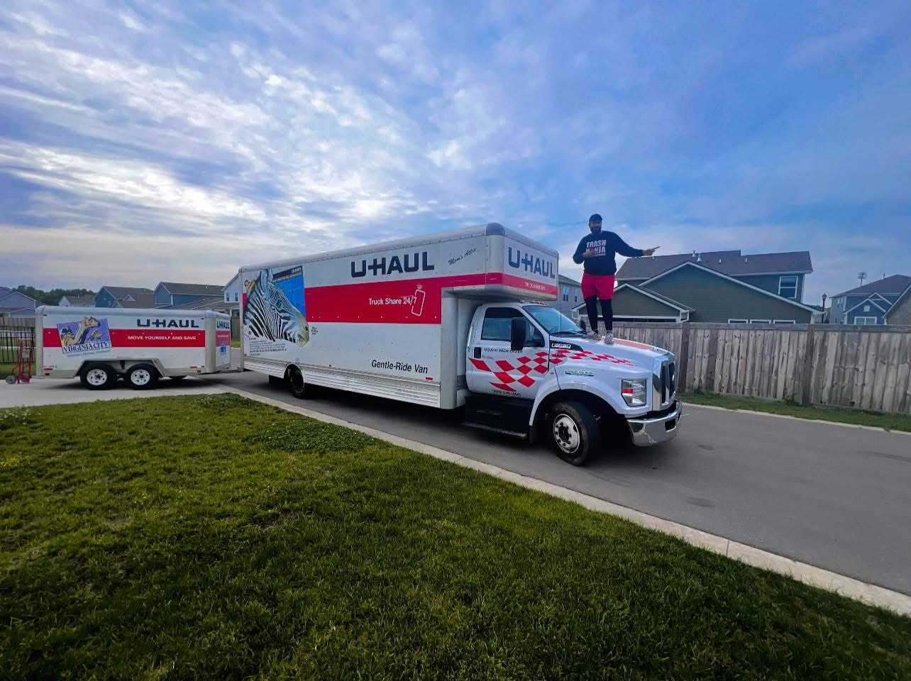Large moving truck and trailer parked for a moving job